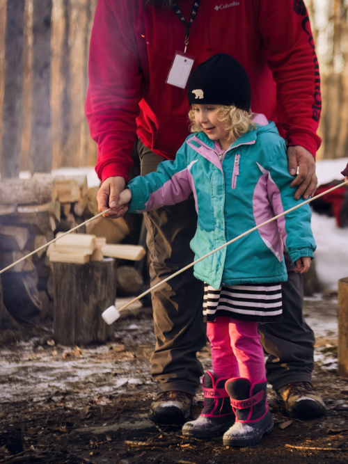 Young learner roasting marshmallows outdoors